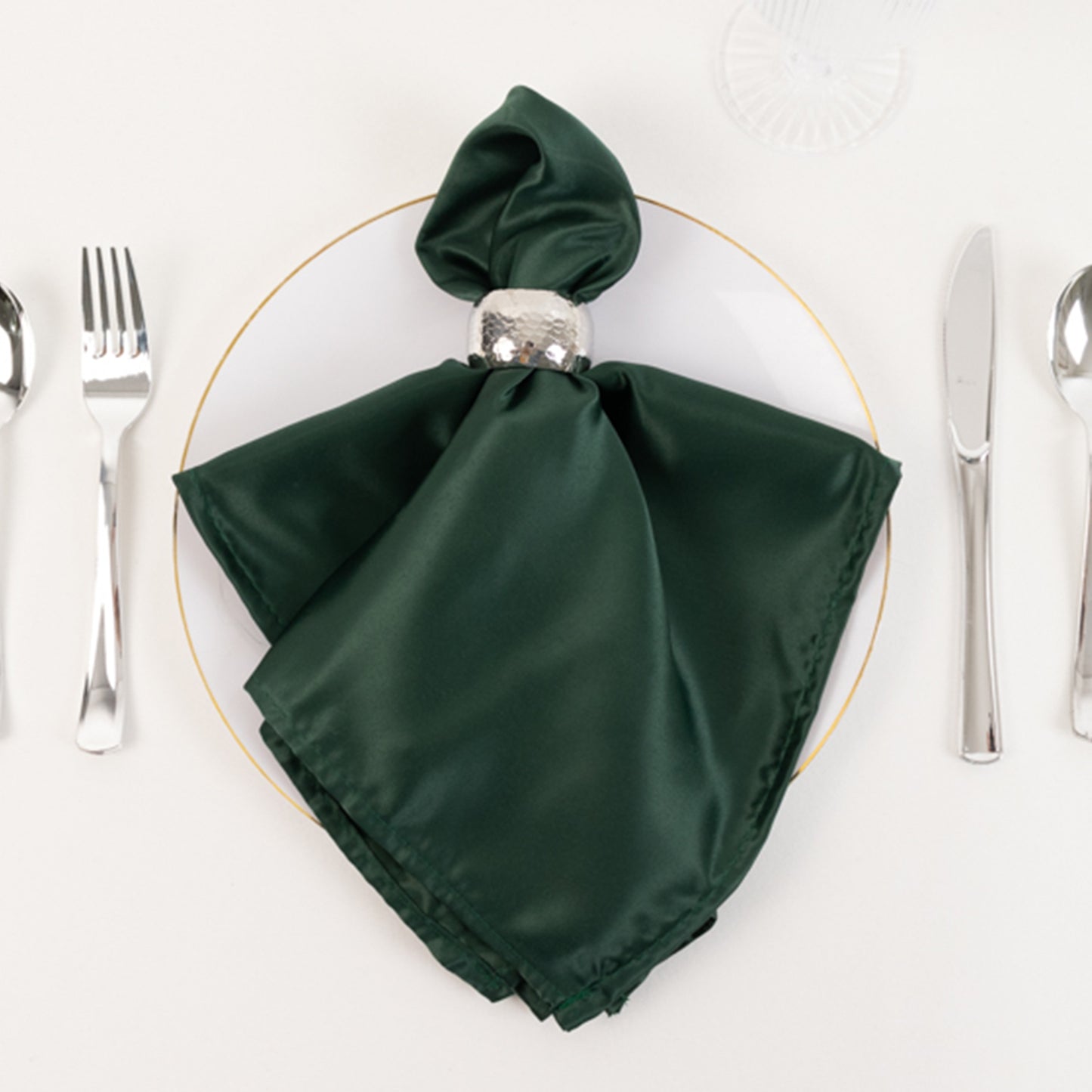 Hunter Emerald Green satin napkin elegantly styled on a table setting.