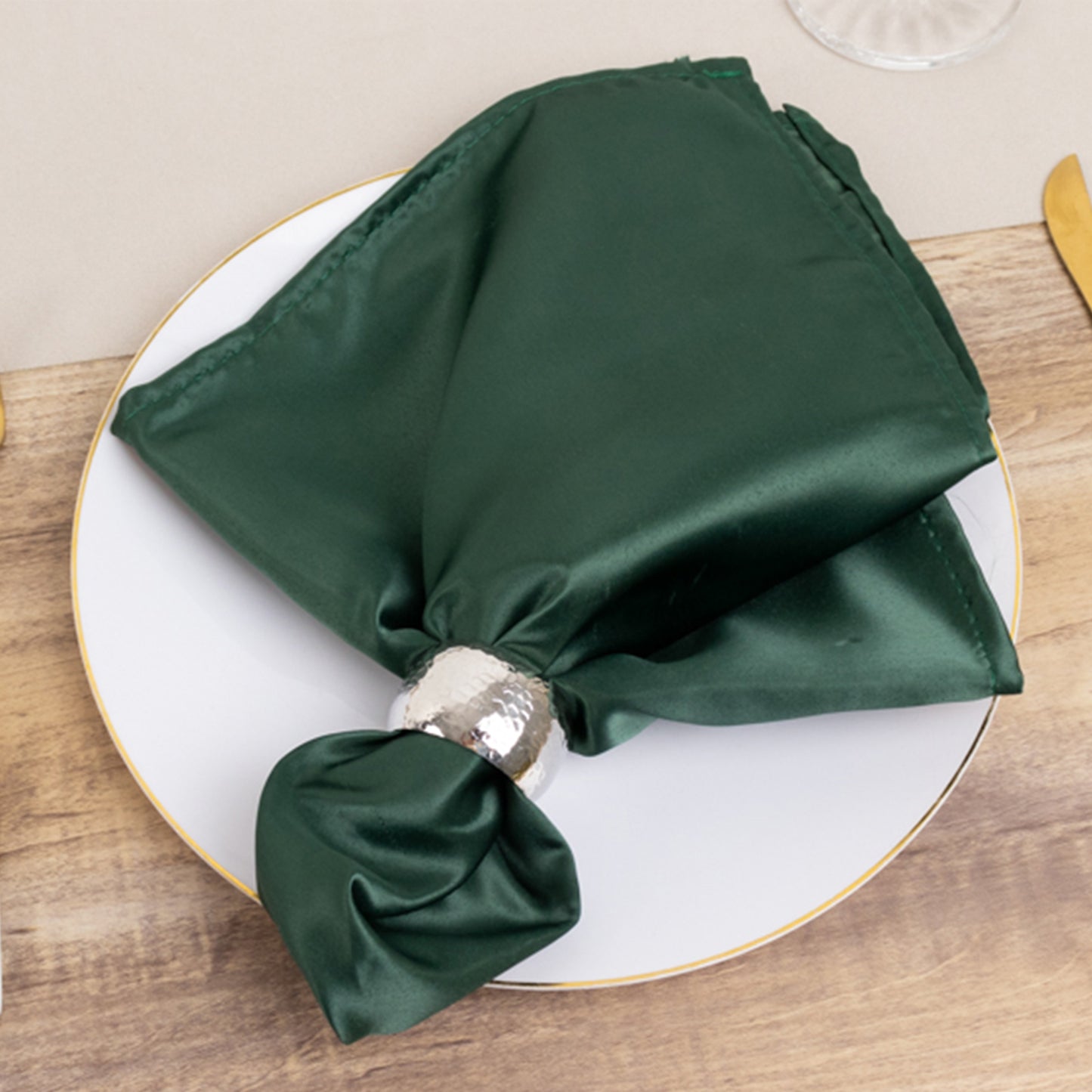 Lamour Satin Napkin - Hunter Emerald Green, 20"x20" on a plate.