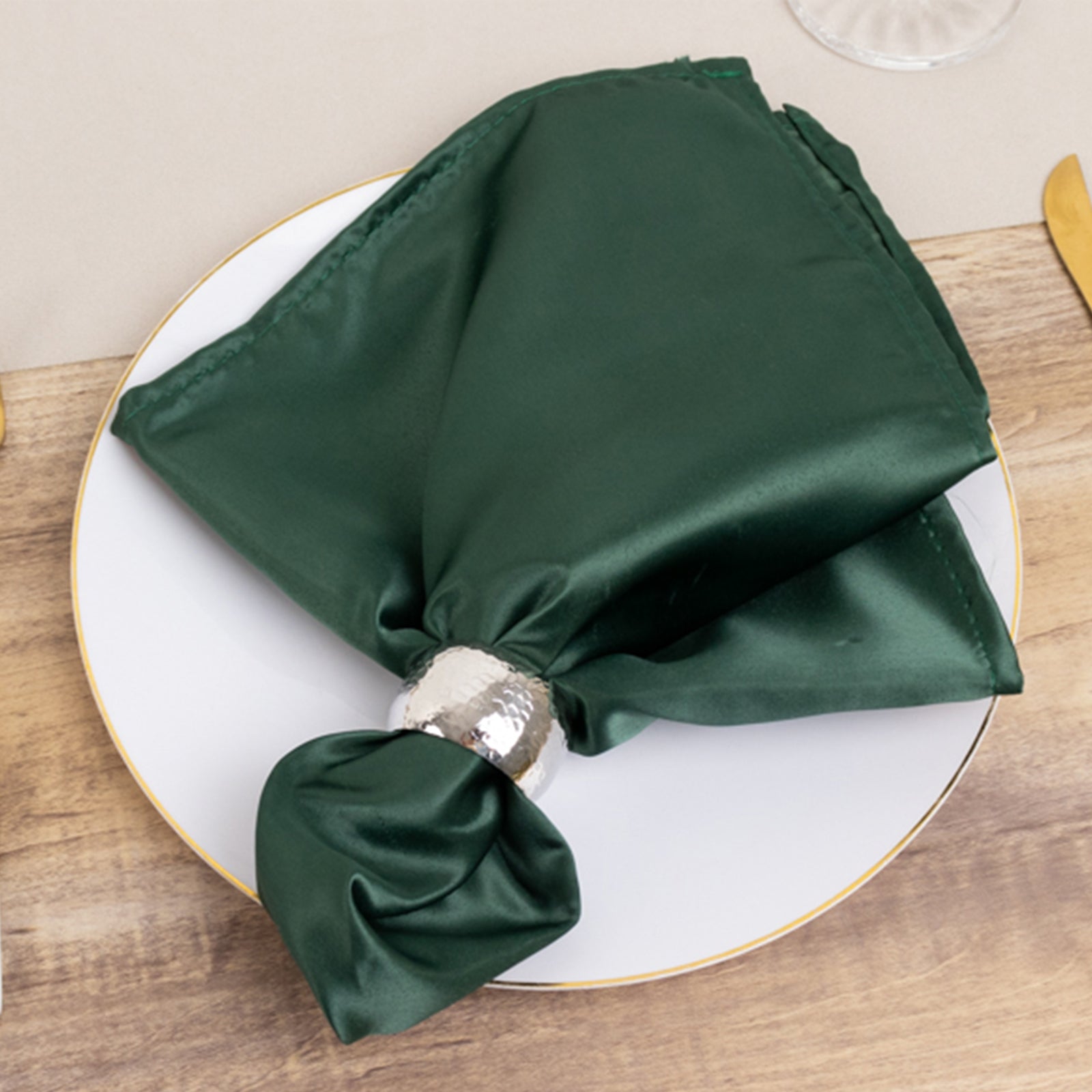 Lamour Satin Napkin - Hunter Emerald Green, 20"x20" on a plate.