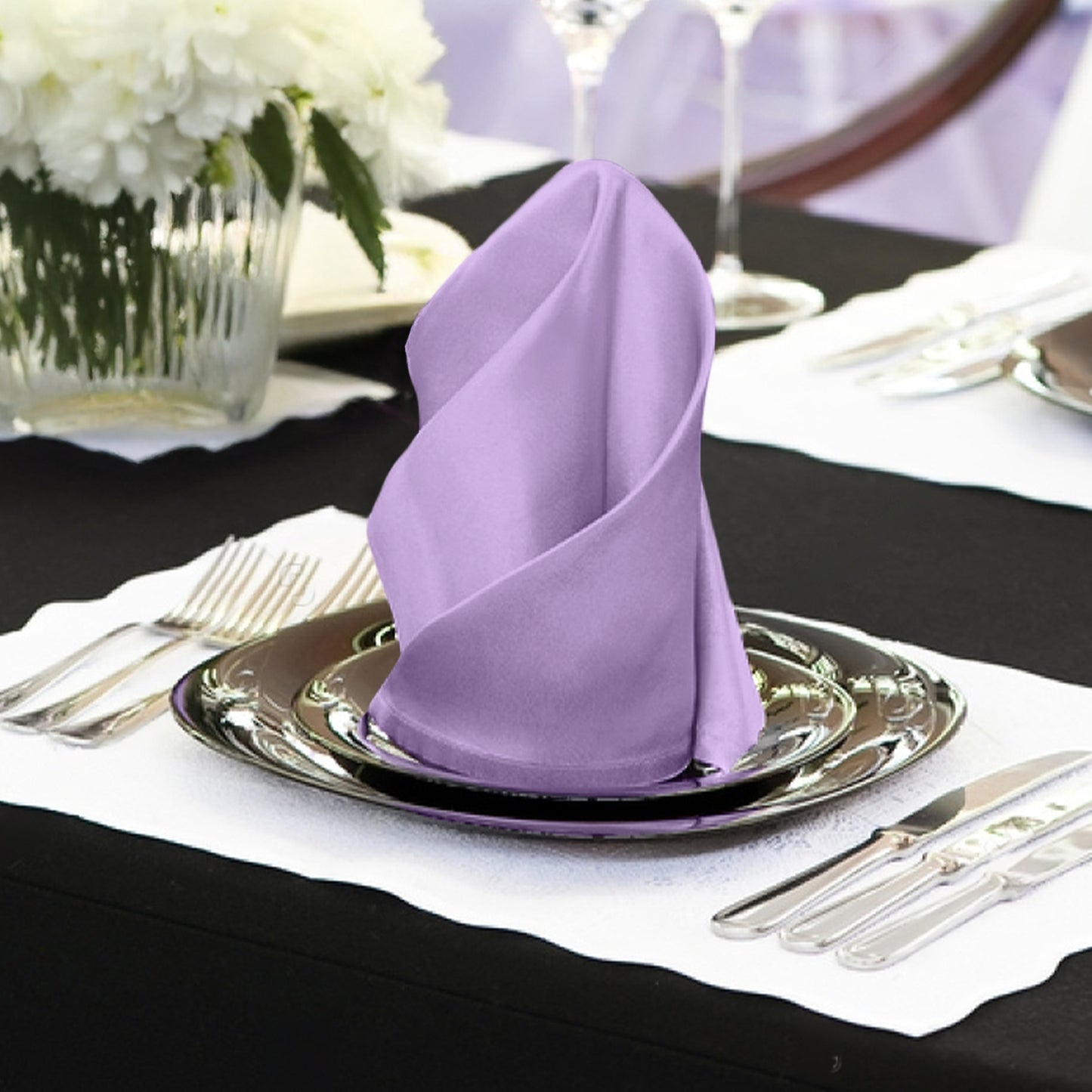 Lavender lilac satin napkins elegantly displayed on a table setting.