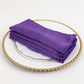 Purple Lamour satin napkins stacked on a decorative plate.