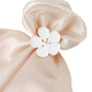 White and gold metal flower napkin ring with plum blossom design.