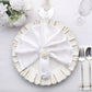 Elegant silver floral napkin rings on a white plate with a napkin.
