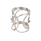 Silver metal napkin ring with rhinestones, elegant hollow woven style.