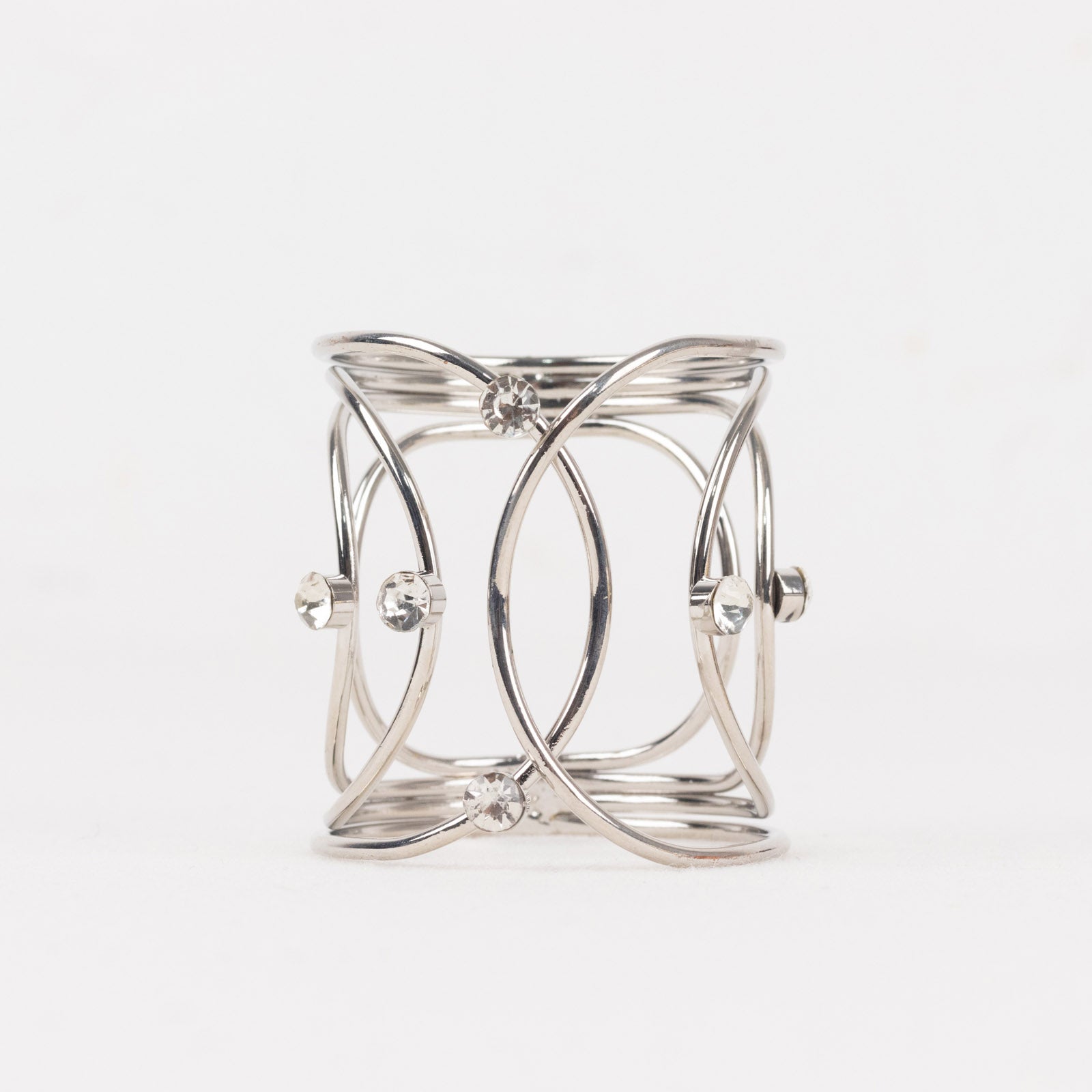 Silver metal napkin ring with rhinestones in hollow woven style.