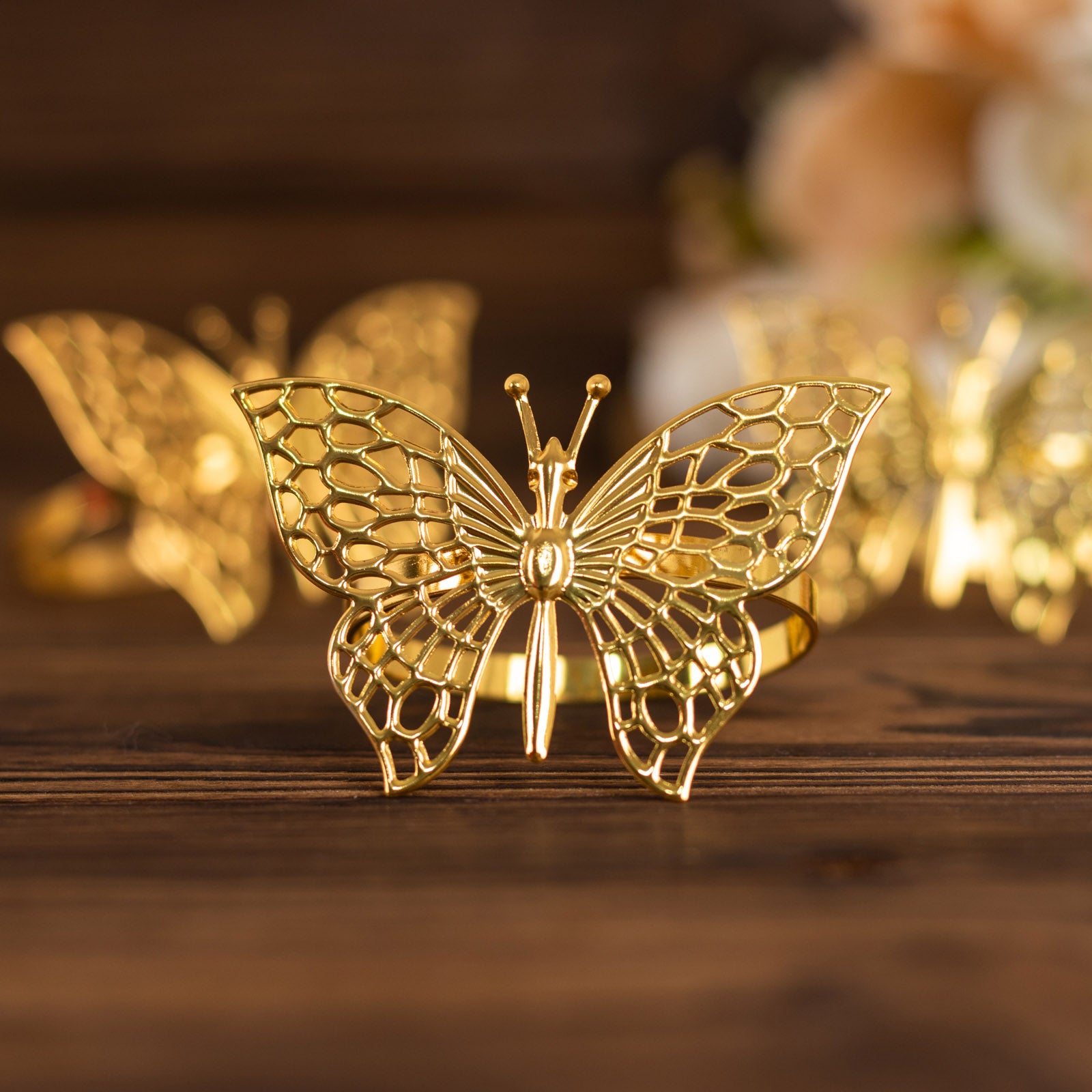 Gold metal butterfly napkin rings for decorative table settings.
