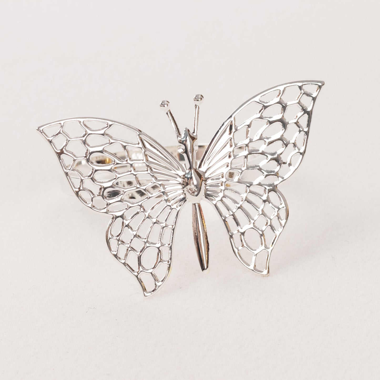 Silver metal butterfly napkin ring, decorative laser cut holder.