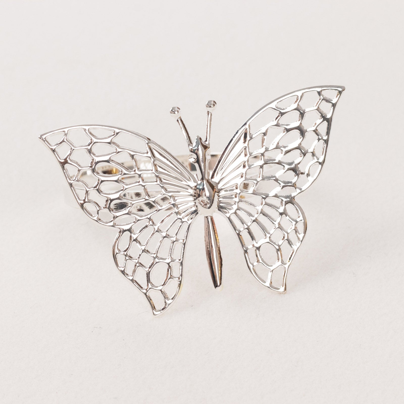 Silver metal butterfly napkin ring, decorative laser cut holder.