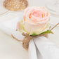 Blush artificial rose flower napkin holder with rustic twine.