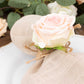 Blush artificial rose wooden napkin holder with farmhouse style.