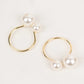 White pearl and gold metal napkin holders for elegant table decor.