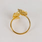 Gold laser cut butterfly napkin holder for elegant dining table decor.
