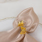 Gold laser cut butterfly napkin holder for elegant dining table decor.