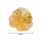 Gold metal jasmine flower napkin holder with pearl center, decorative floral design.