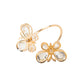 Gold butterfly napkin holder with crystal accents for weddings and events.