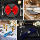 Gold butterfly napkin holders with crystal accents on elegant table settings.