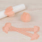 Blush shimmery laser cut heart paper napkin holders with lace pattern.
