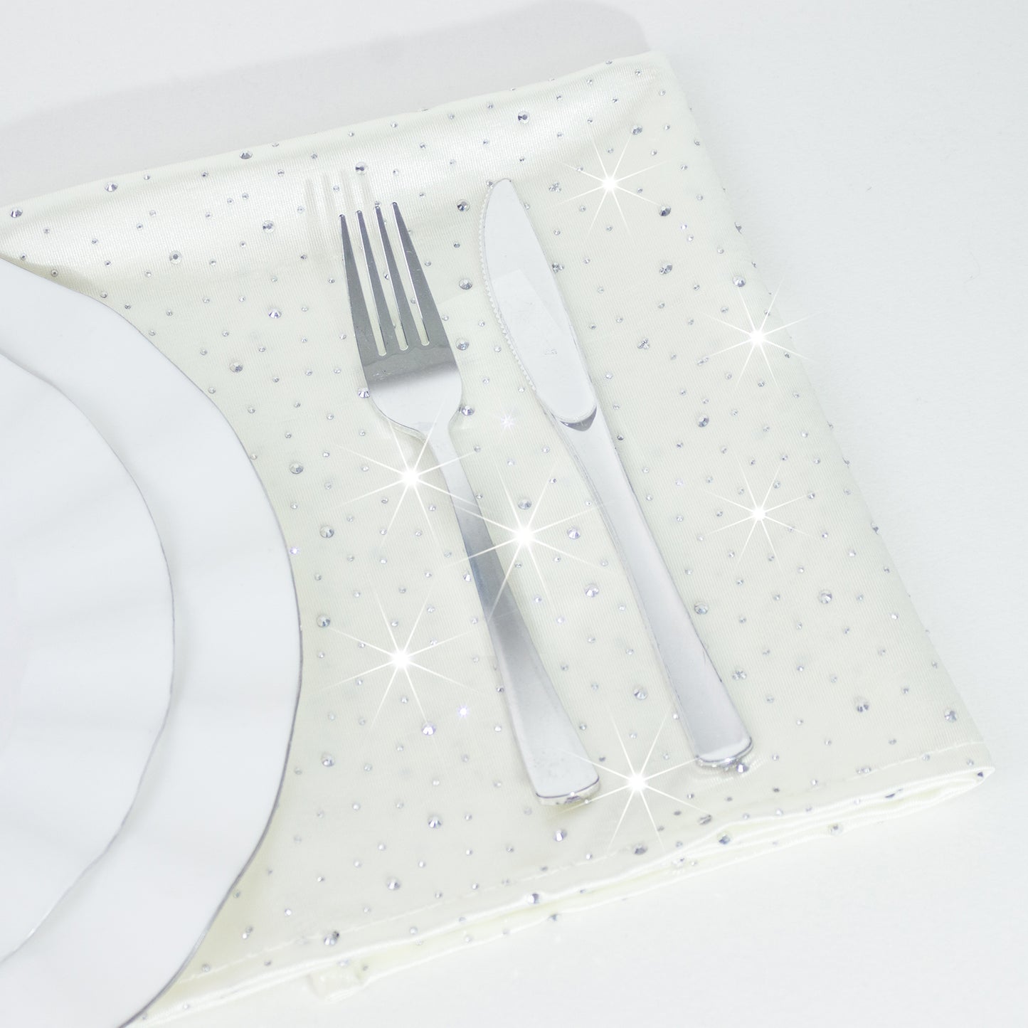 Pearl white reusable cloth napkins with rhinestone accents.