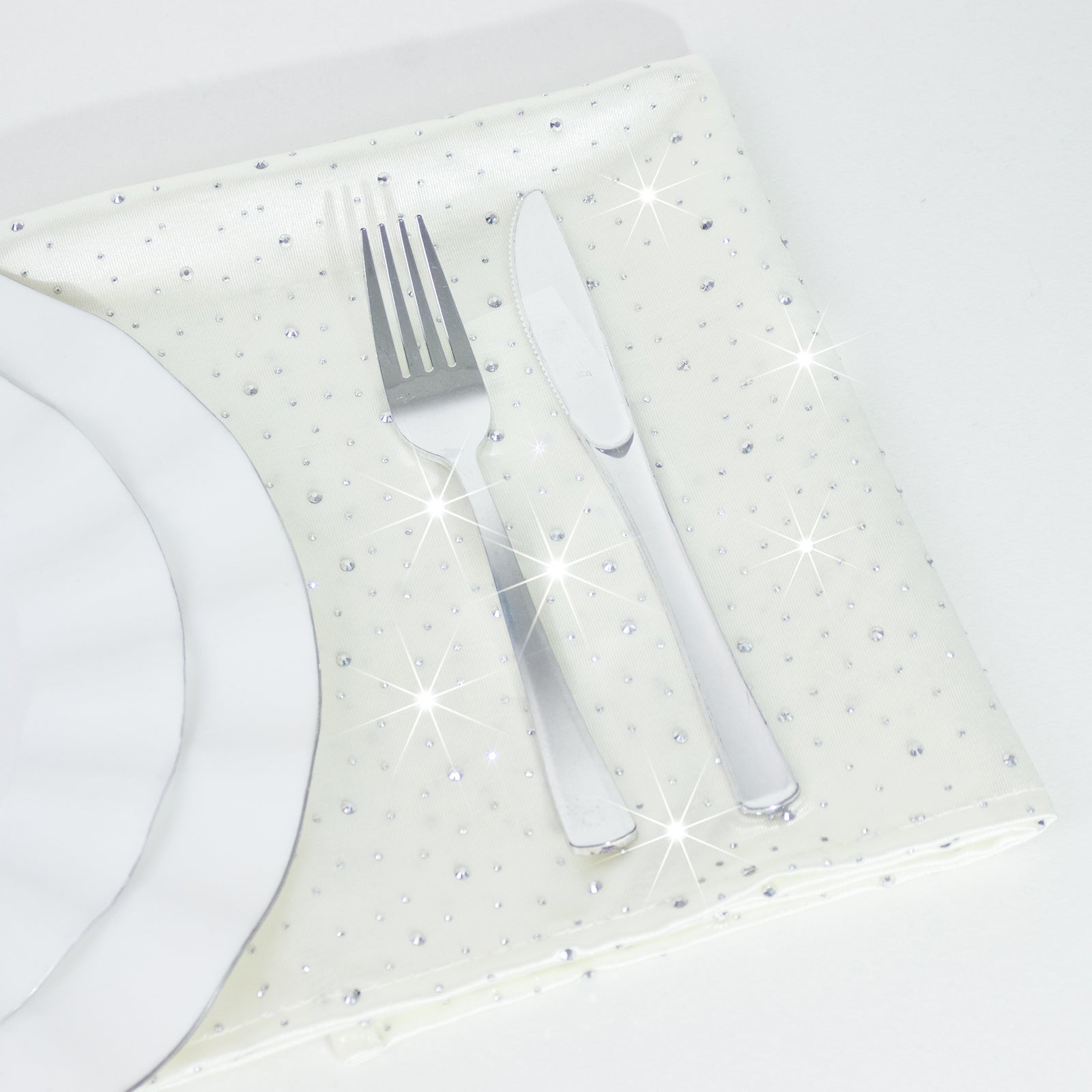 Pearl white reusable cloth napkins with rhinestone accents.