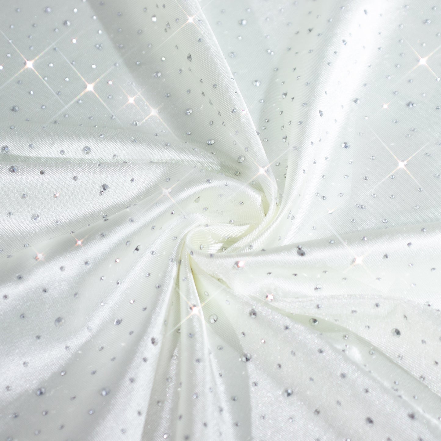Pearl white reusable cloth napkins with rhinestone accents.