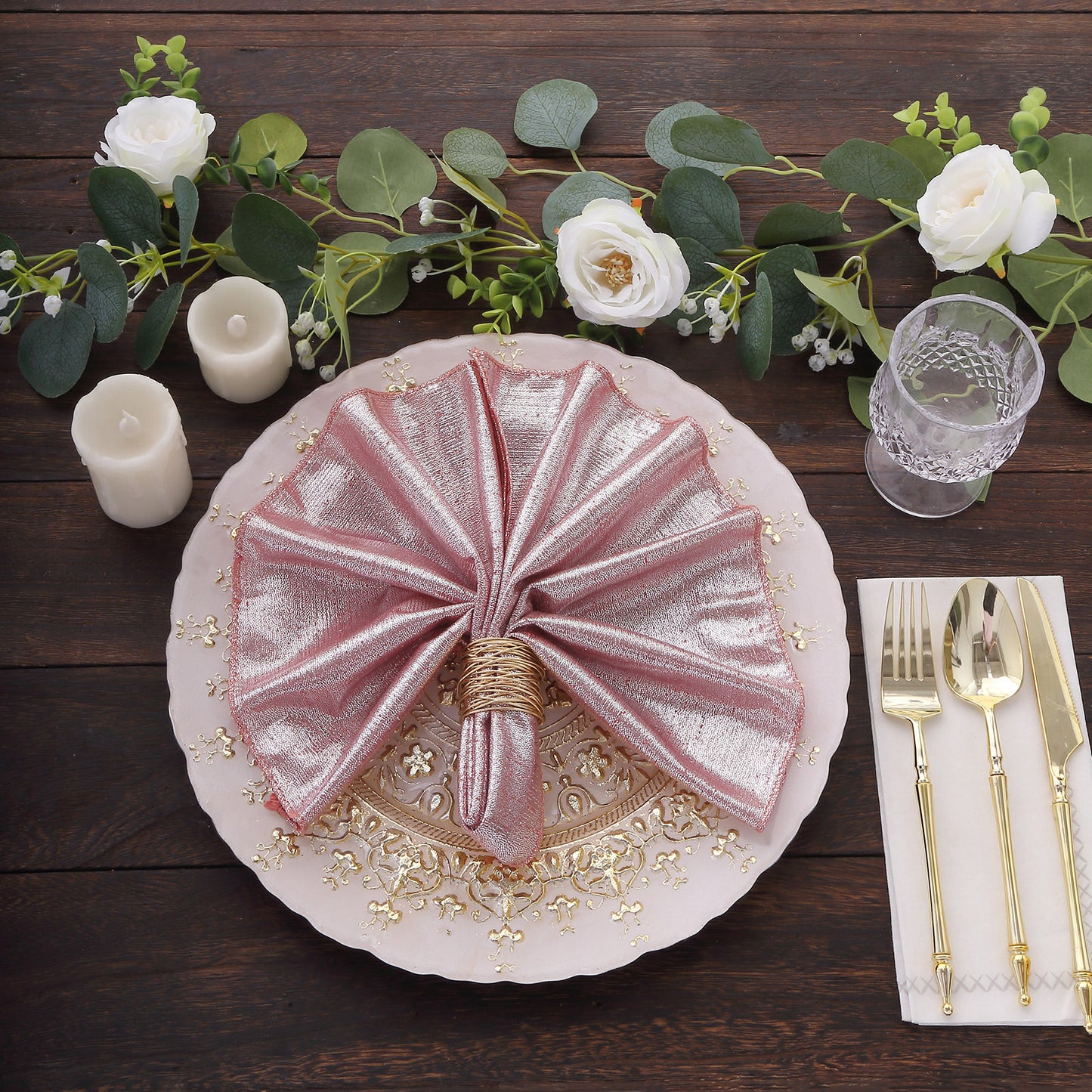 Rose gold shimmer sequin napkins on a dinner table setting.