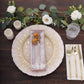 Rose gold shimmer sequin dots polyester table napkins on a decorative plate.