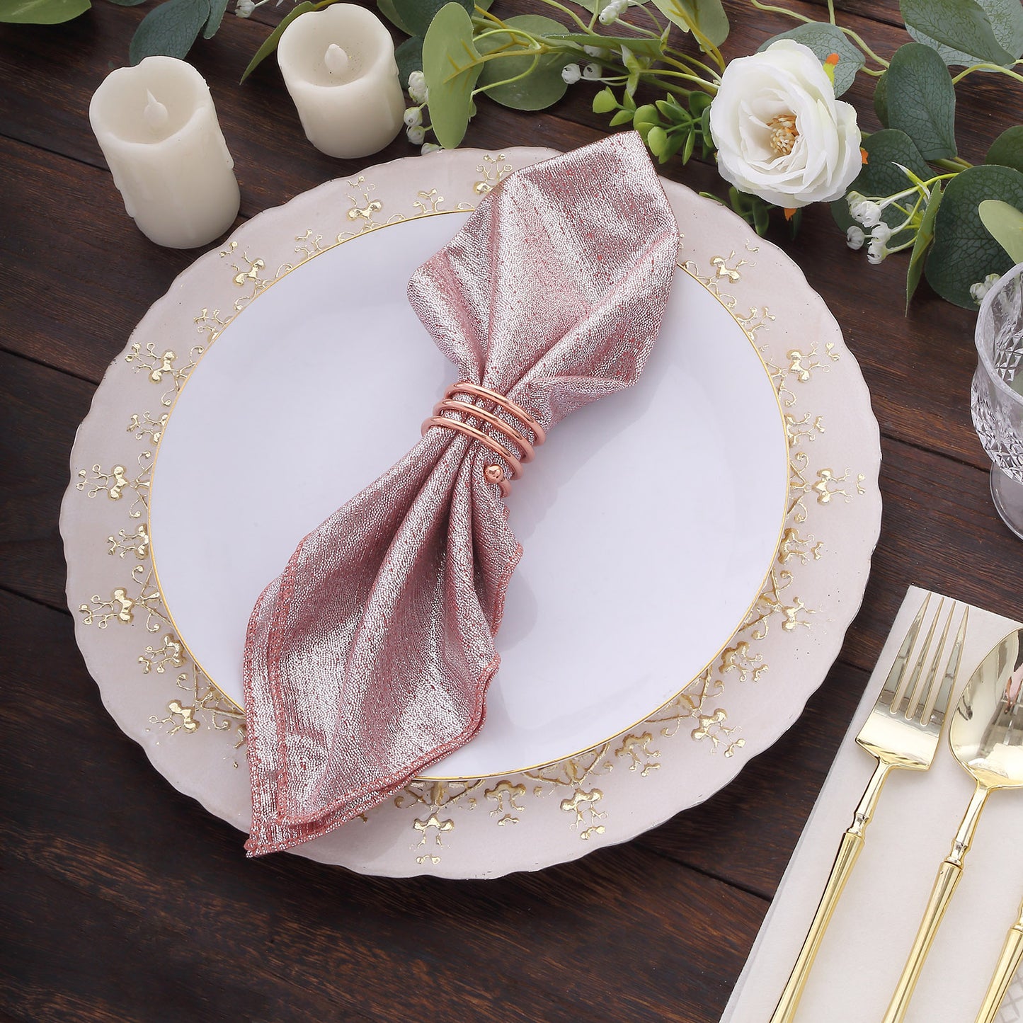 Rose gold shimmer sequin table napkin on an elegant dinner setting.