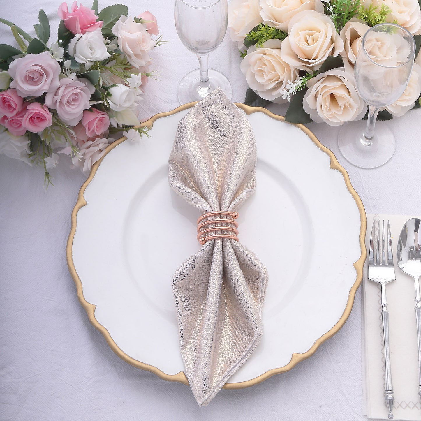 Beige shimmer sequin table napkin on a beautifully set dining table.