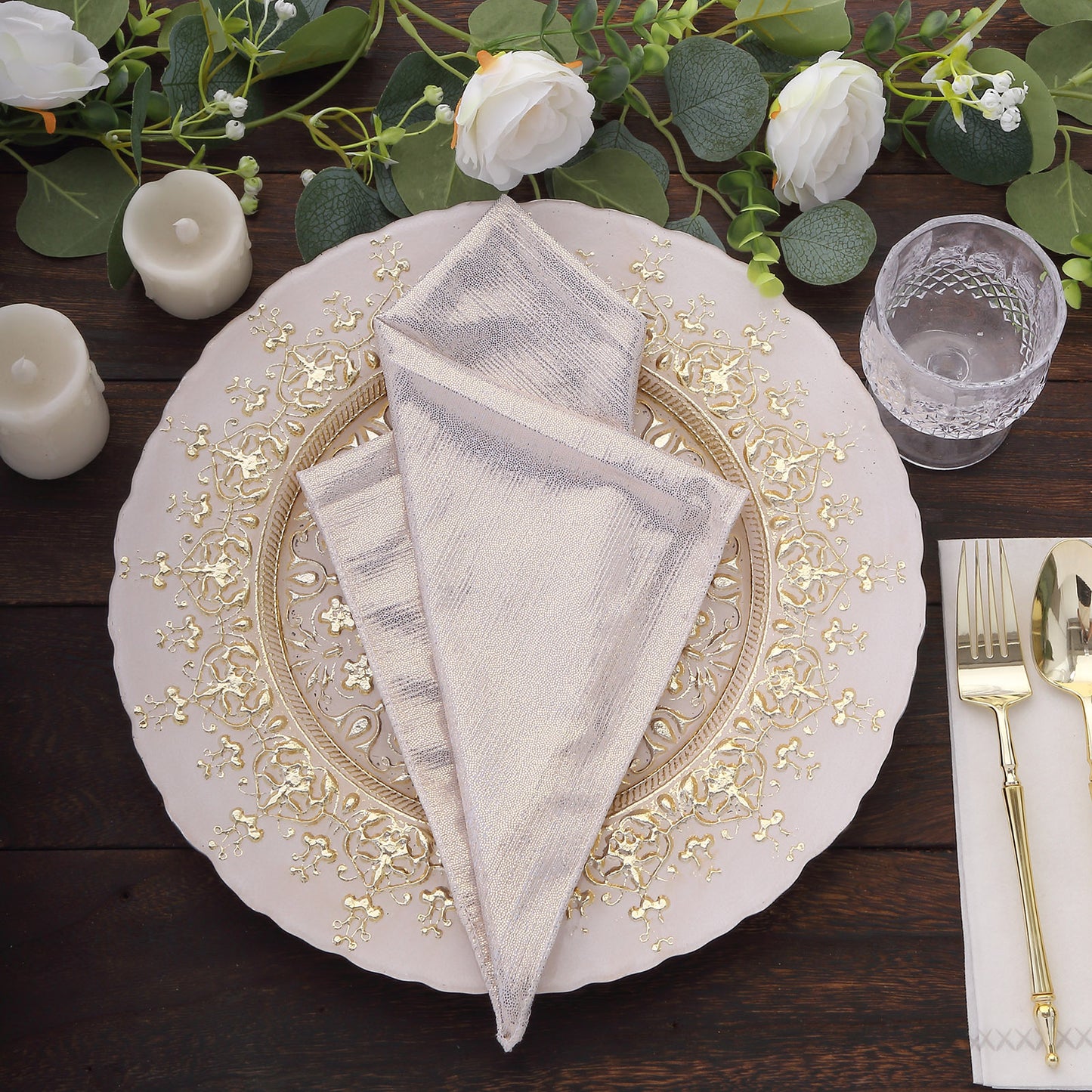 Beige shimmer sequin table napkins on an elegant dinner setting.