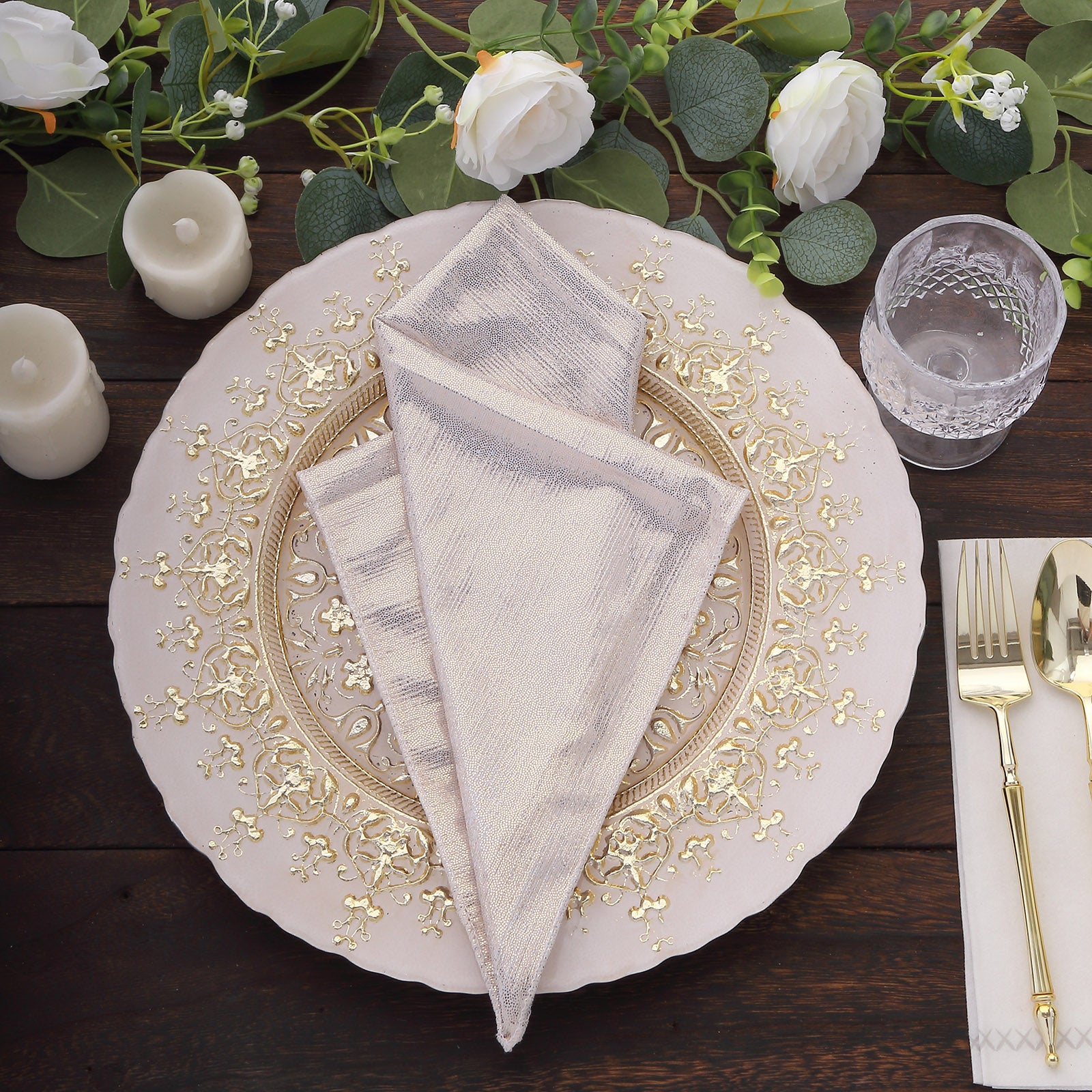 Beige shimmer sequin table napkins on an elegant dinner setting.