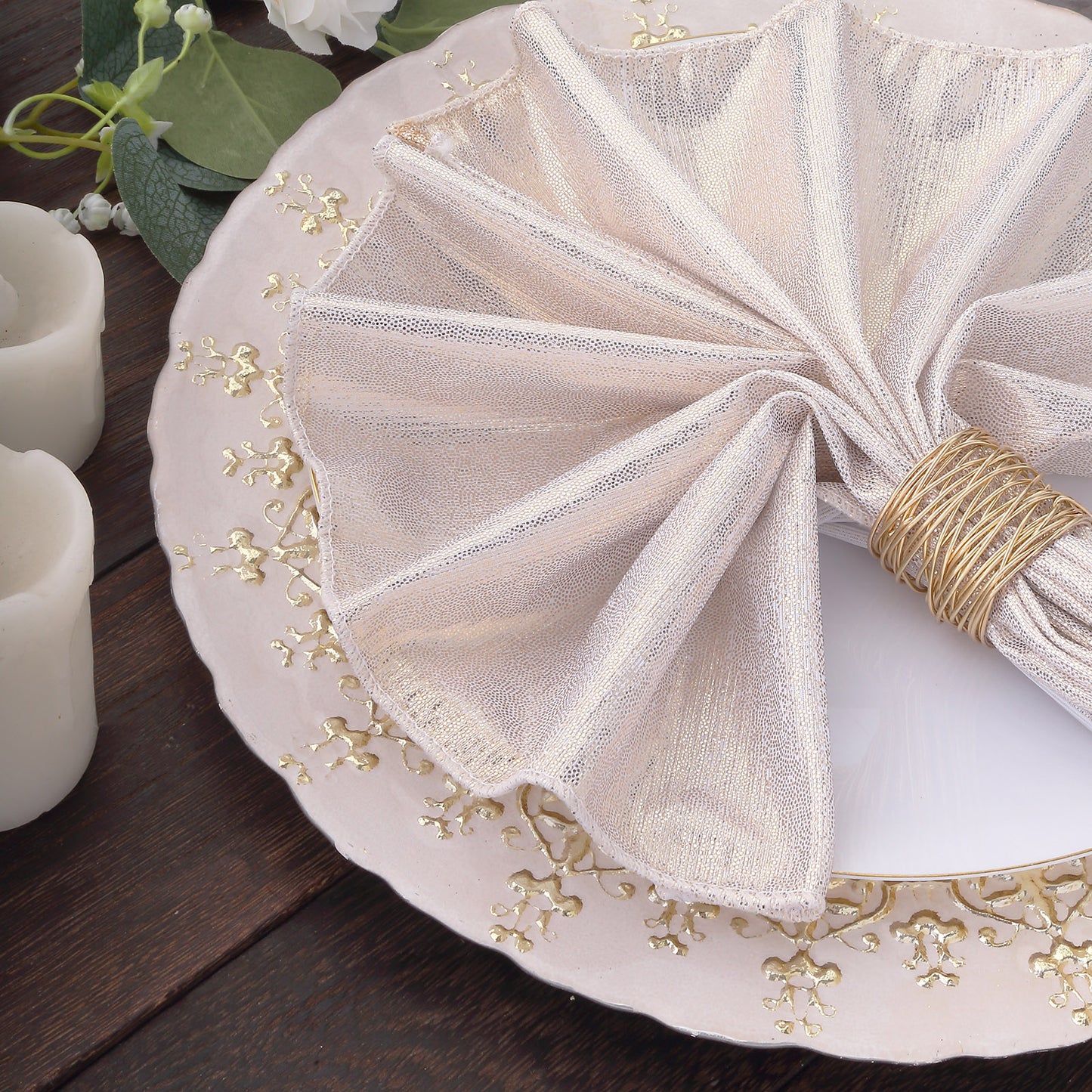 Beige shimmer sequin dot napkins on an elegant dinner plate.