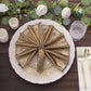 Antique gold shimmer sequin dot napkins on a decorative plate.