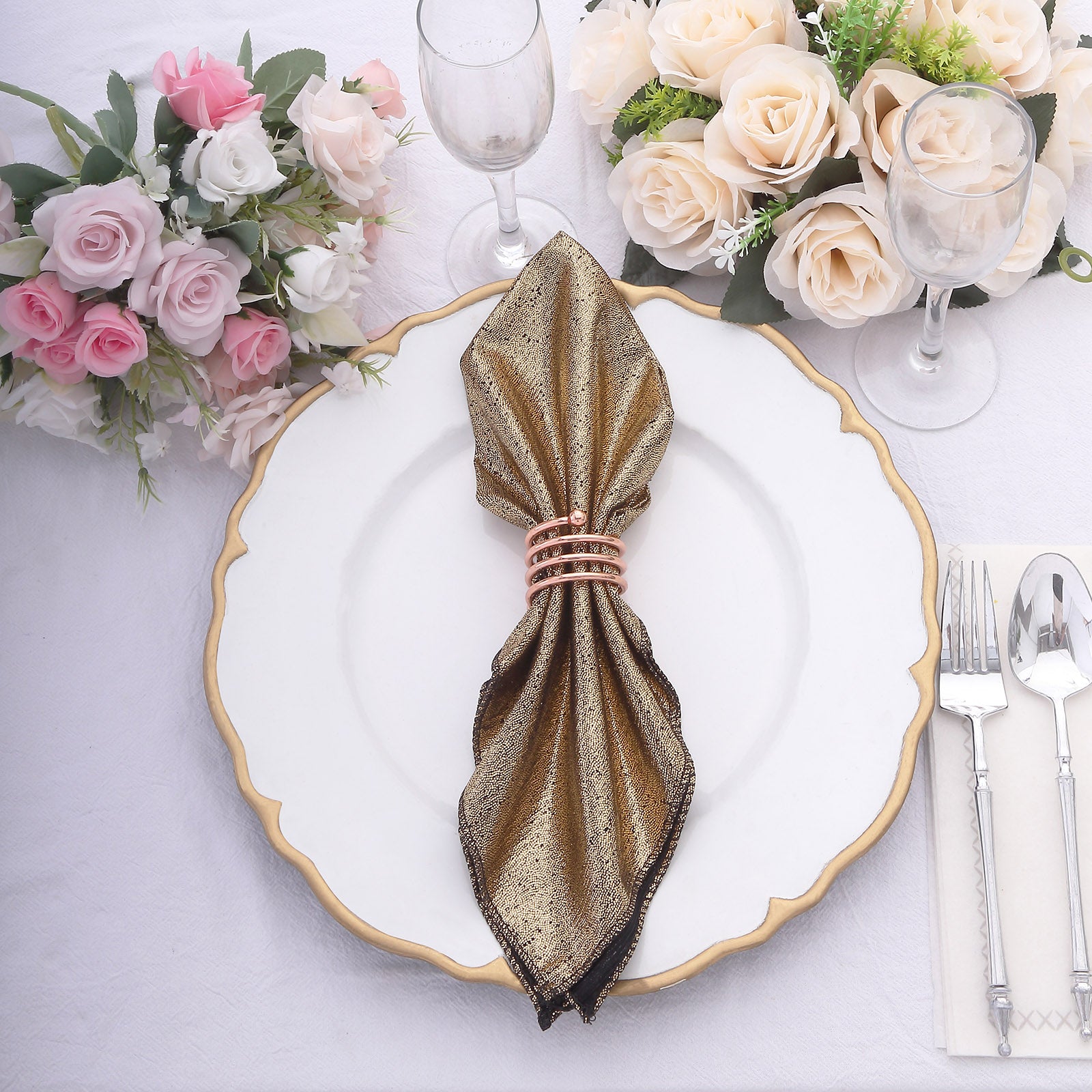 Antique gold shimmer sequin table napkin on a dinner plate.