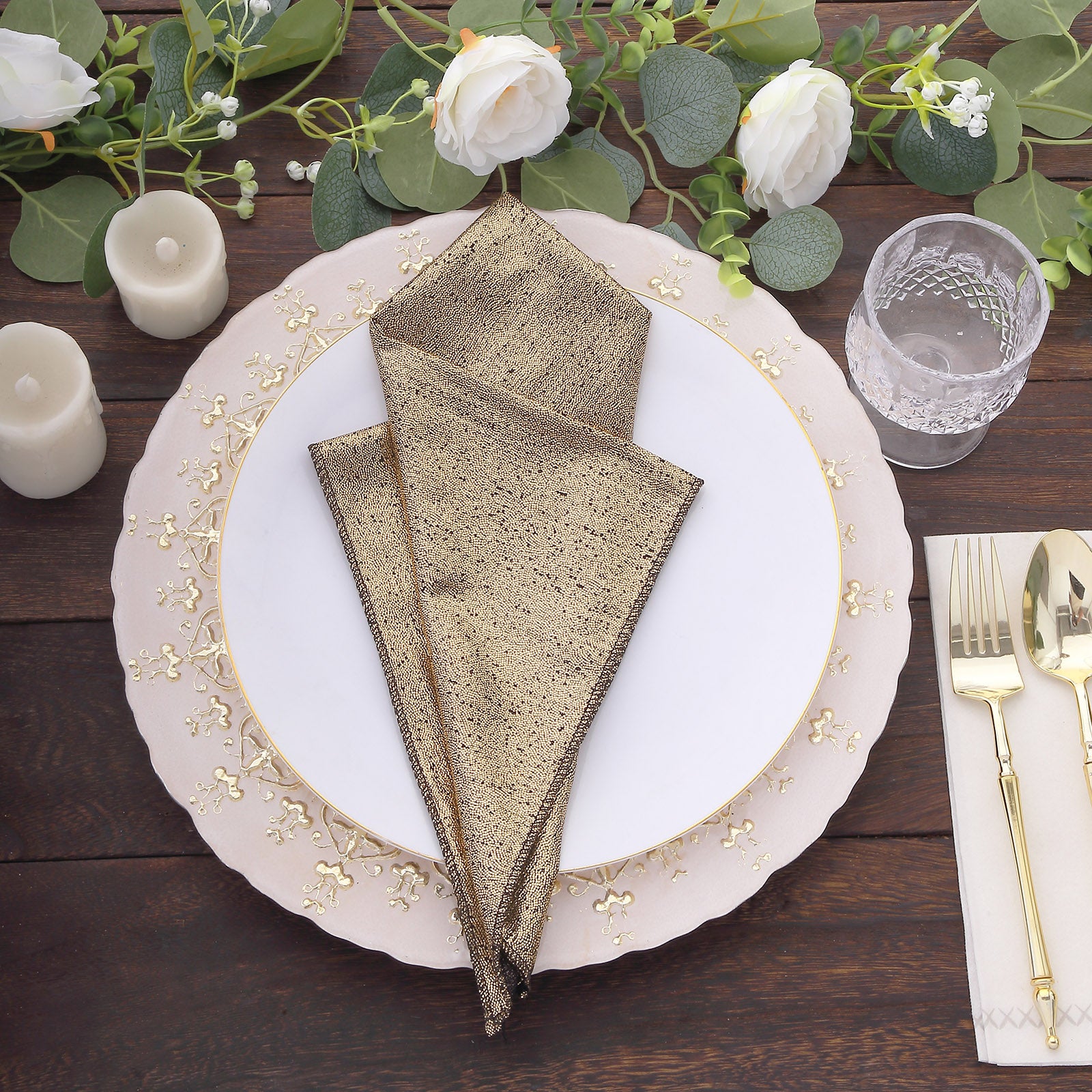 Antique gold shimmer sequin table napkins on an elegant dinner setting.