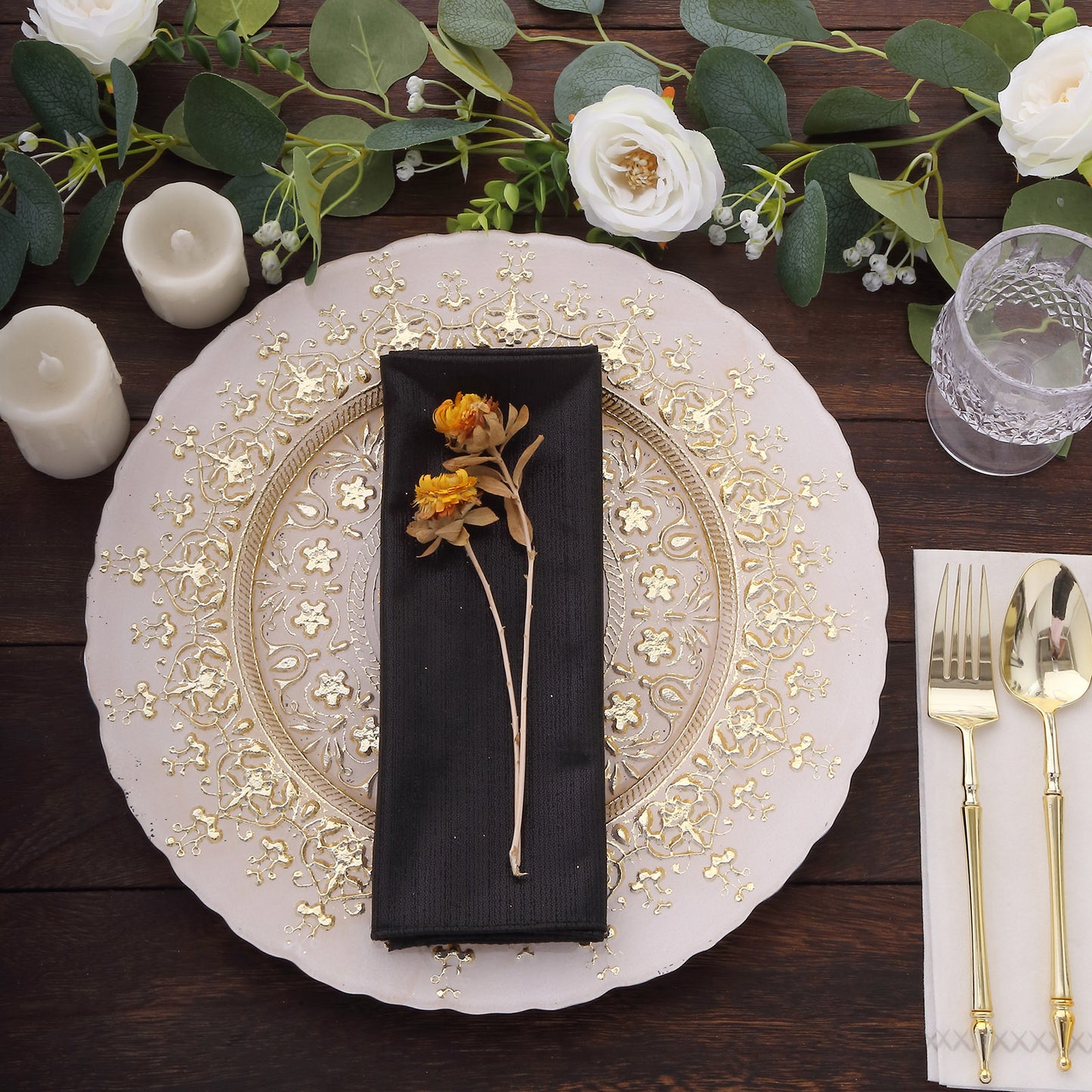 Black shimmer sequin dots polyester table napkin on an elegant dinner setting.