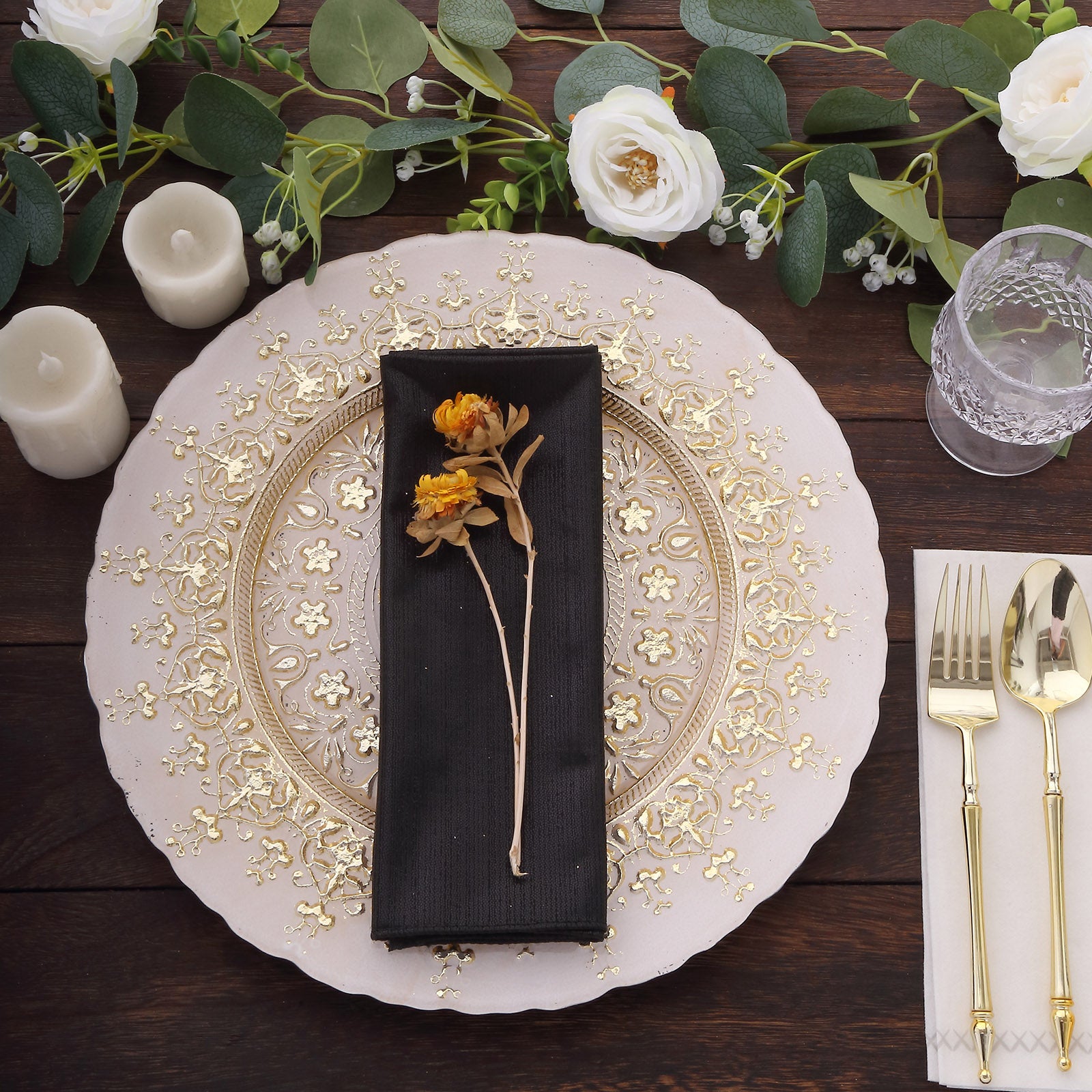 Black shimmer sequin dots polyester table napkin on an elegant dinner setting.
