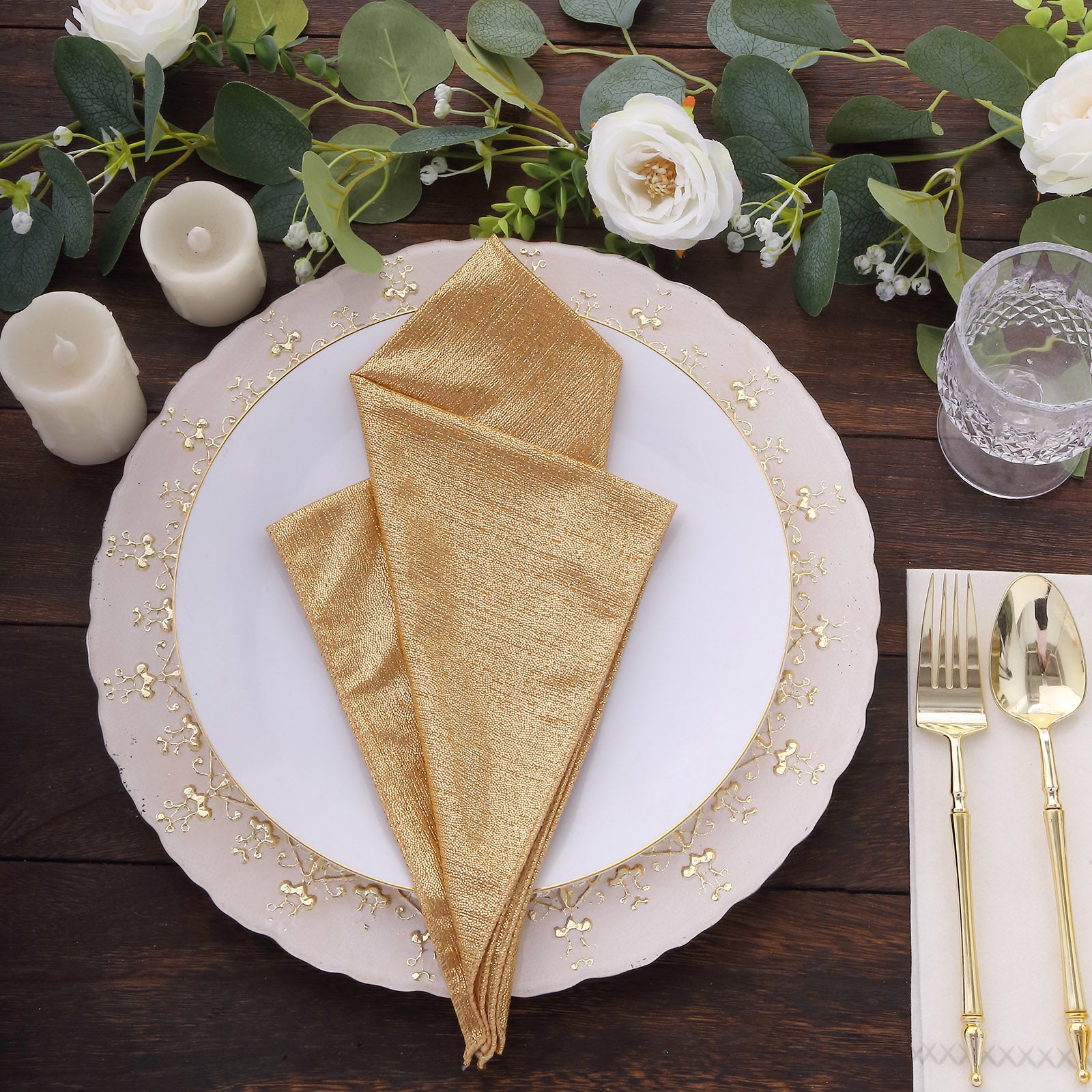 Gold shimmer sequin napkins on a dining table setting.