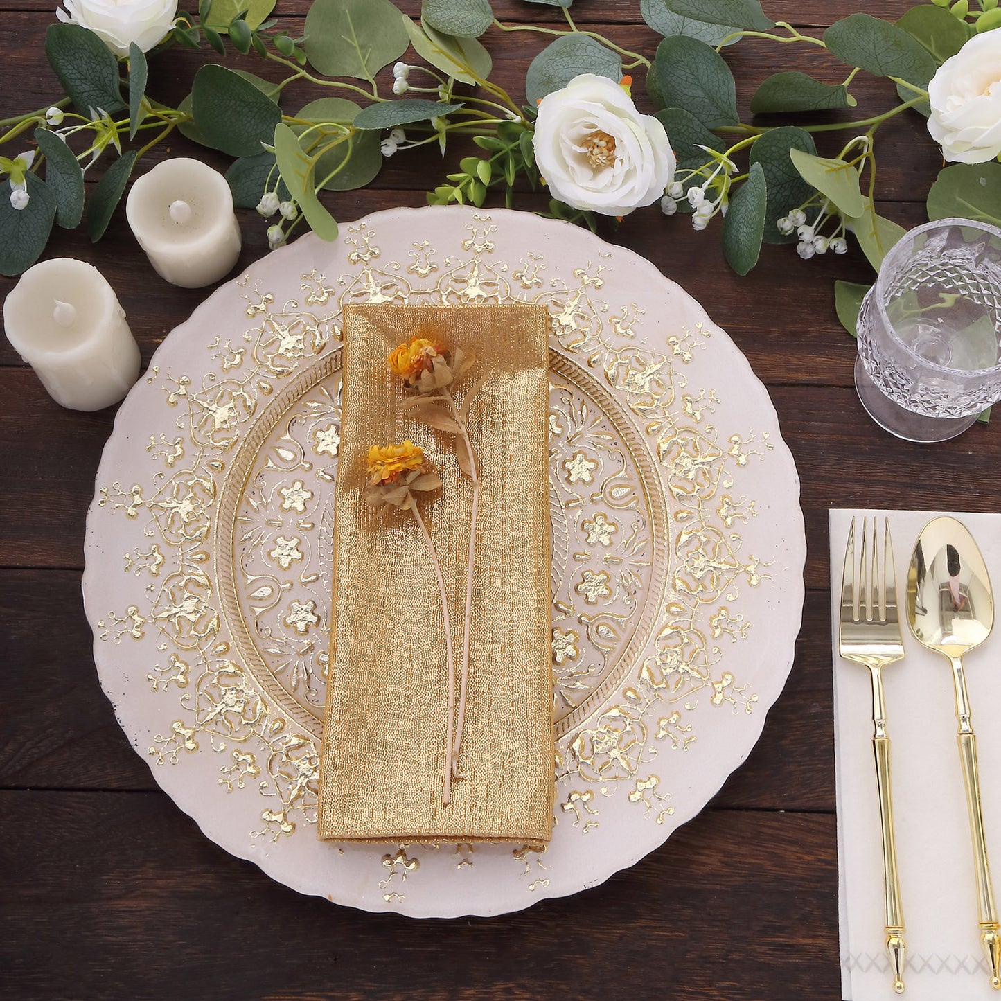 Gold shimmer sequin dots table napkins on an elegant dinner setting.