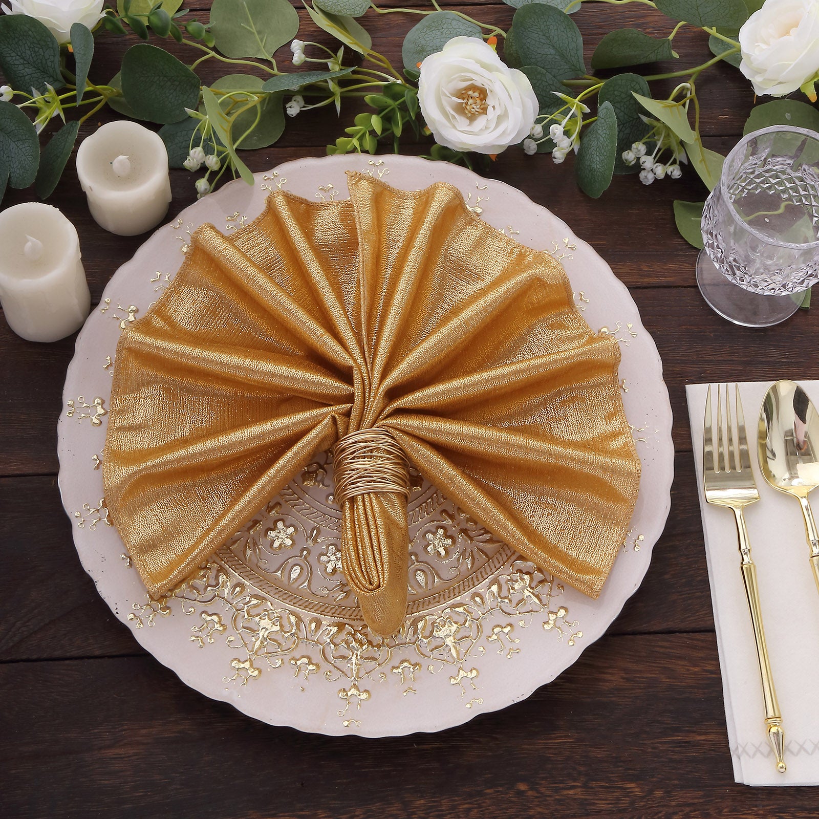 Gold sequin napkins on an elegant dinner table setting.