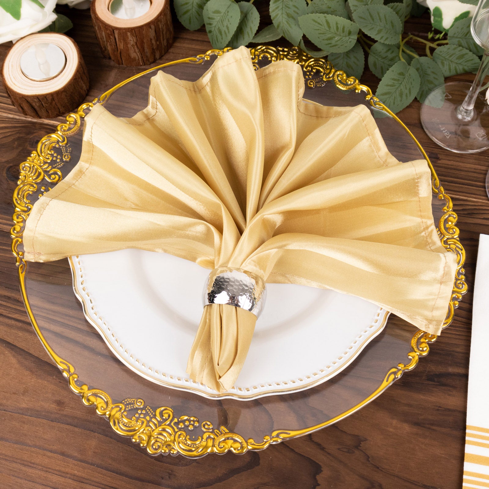 Champagne satin linen napkin elegantly displayed on a decorative plate.