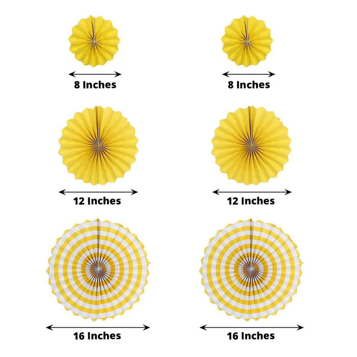 Yellow hanging paper fan decorations in various sizes for party backdrop.
