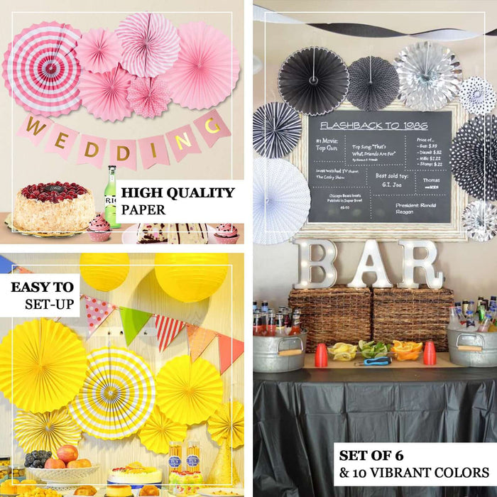 Metallic silver hanging paper fan decorations for party backdrop.