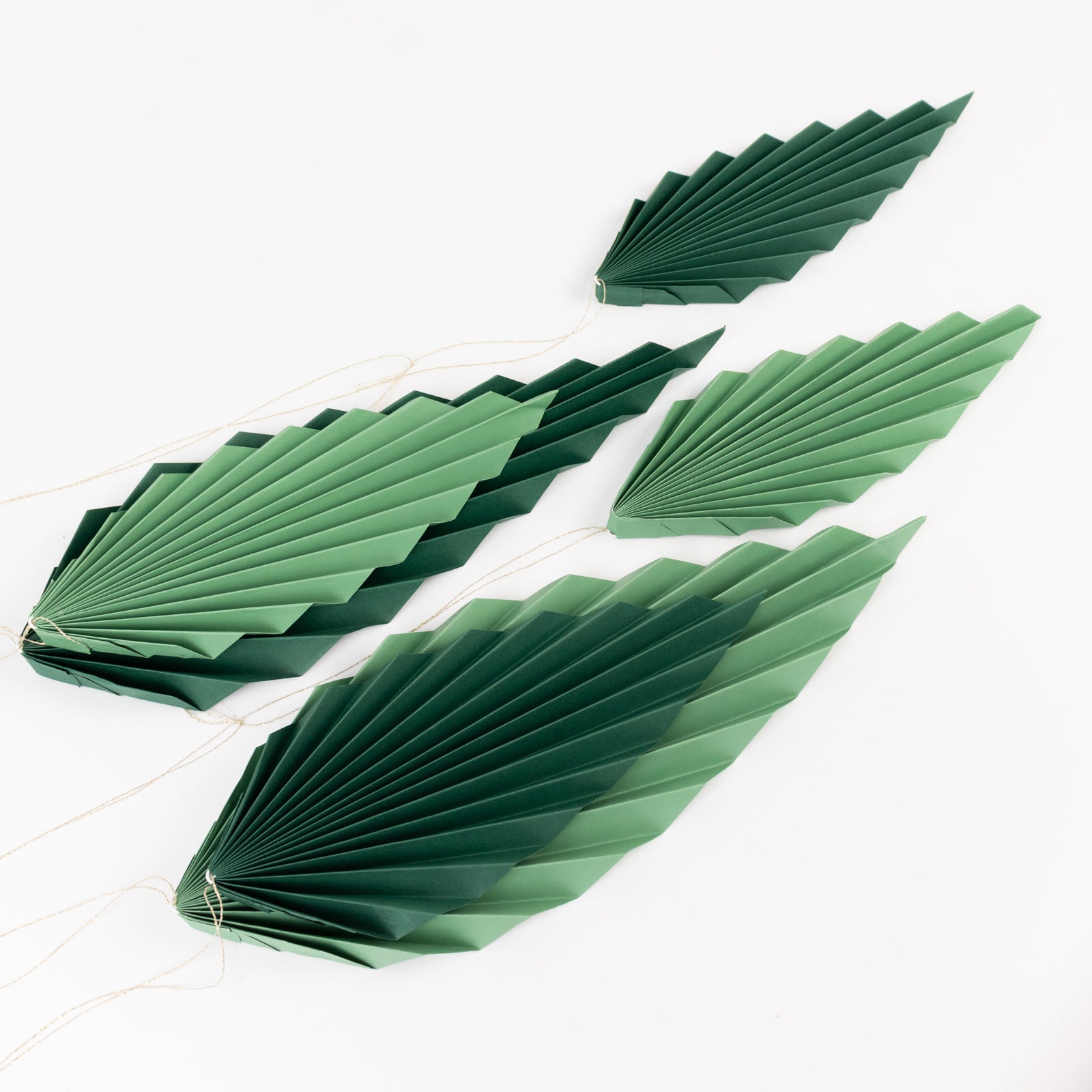 Set of 6 mixed green leaves hanging paper fans backdrop decor.