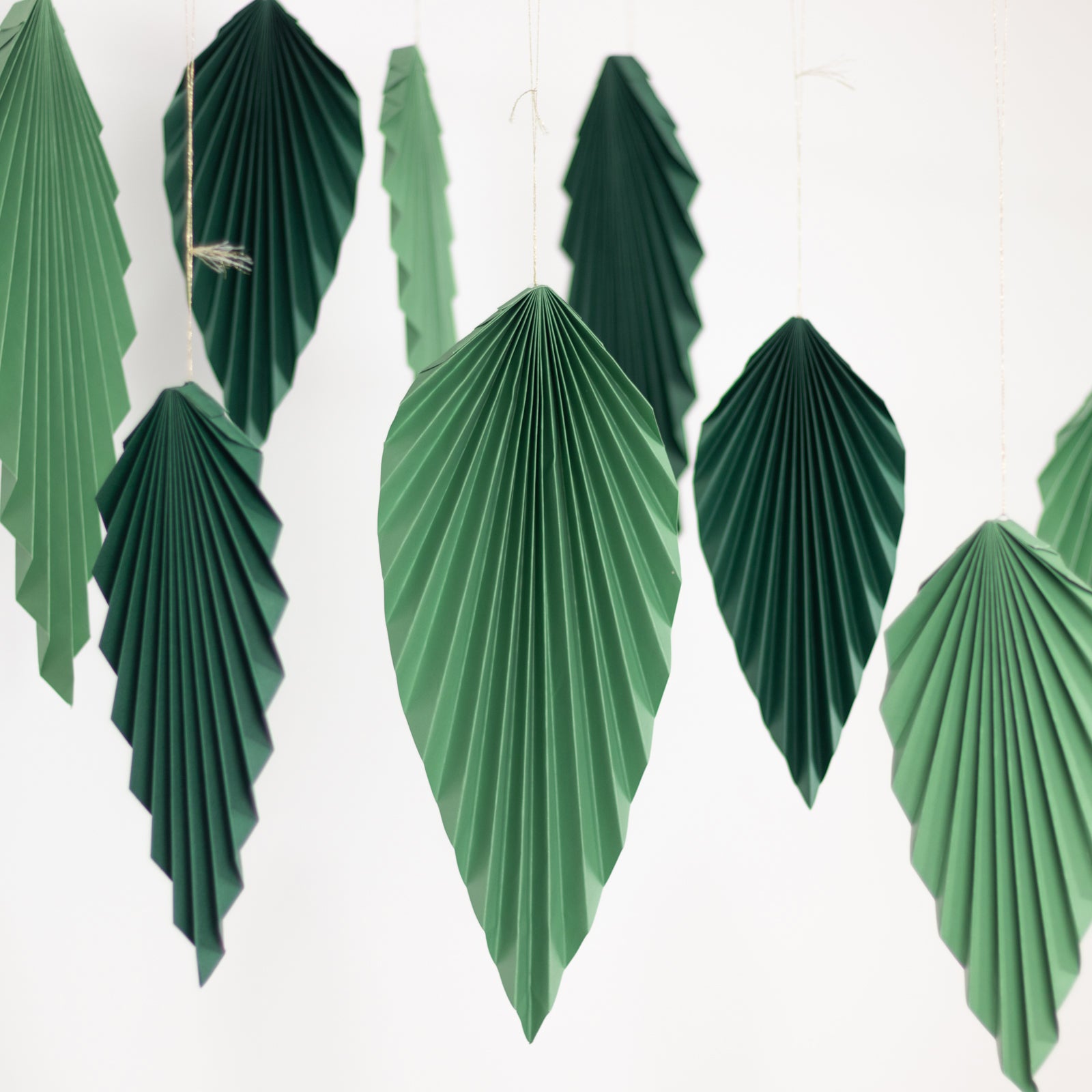 Set of 6 mixed green leaves hanging paper fans backdrop decor.