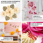 Set of 9 pink 3D rose paper flowers with gold tropical palm leaves.