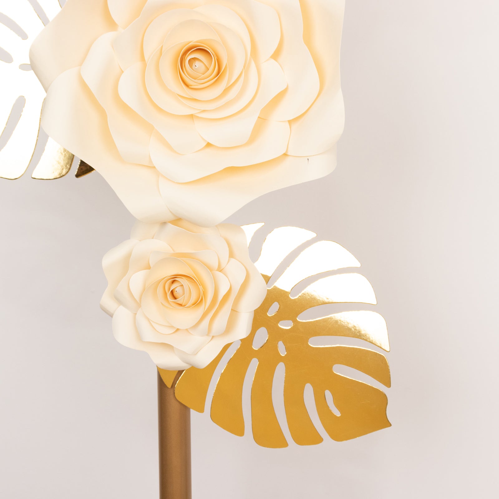 Ivory 3D rose paper flowers with gold tropical palm leaves, wall decor.