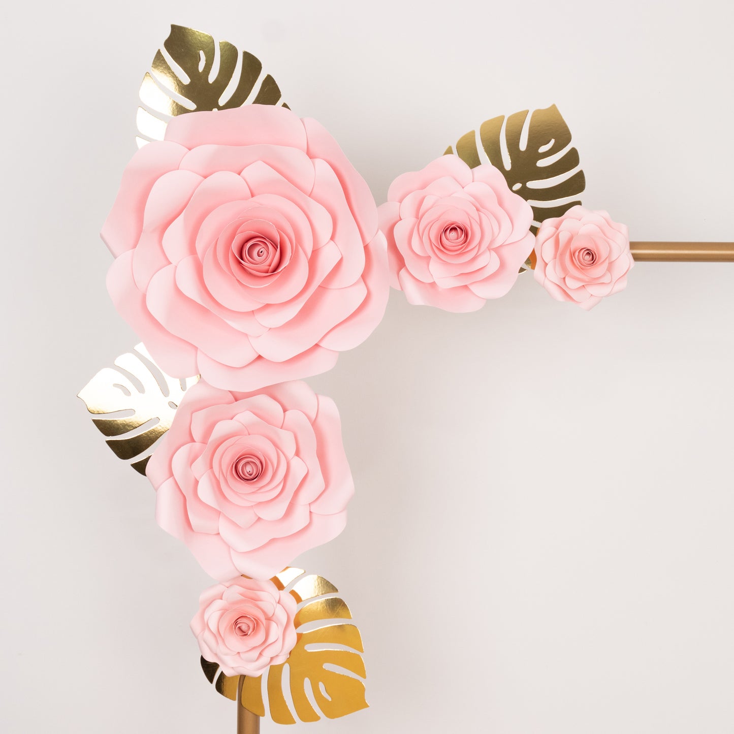 Pink 3D rose paper flowers with gold tropical palm leaves decor.