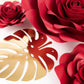 Set of 9 red 3D rose paper flowers with gold palm leaves for decor.