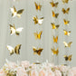 Gold 3D paper butterfly garland streamers for party decor.