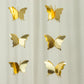 Gold 3D paper butterfly hanging garland streamers for party decor.